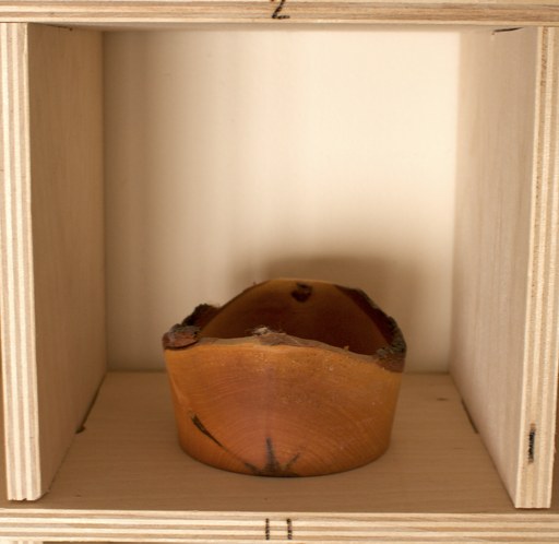 81 hand-turned wooden bowls on a home-made 9x9 compartment shelf