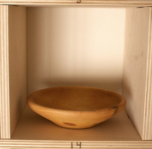 81 hand-turned wooden bowls on a home-made 9x9 compartment shelf