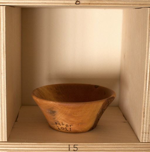 81 hand-turned wooden bowls on a home-made 9x9 compartment shelf