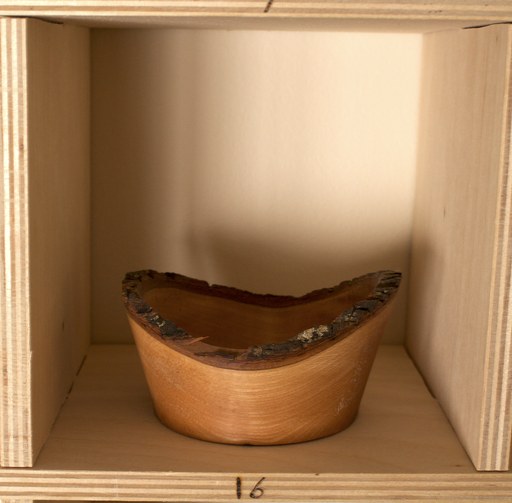 81 hand-turned wooden bowls on a home-made 9x9 compartment shelf