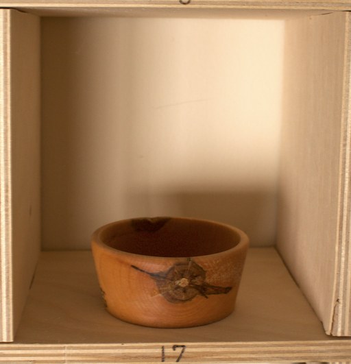 81 hand-turned wooden bowls on a home-made 9x9 compartment shelf