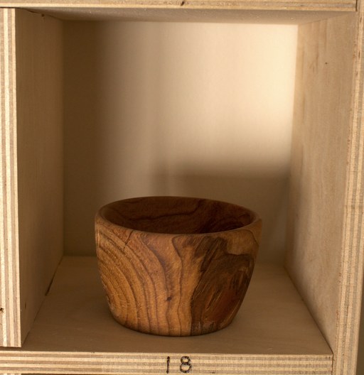 81 hand-turned wooden bowls on a home-made 9x9 compartment shelf