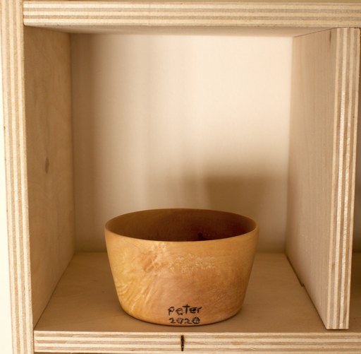 81 hand-turned wooden bowls on a home-made 9x9 compartment shelf