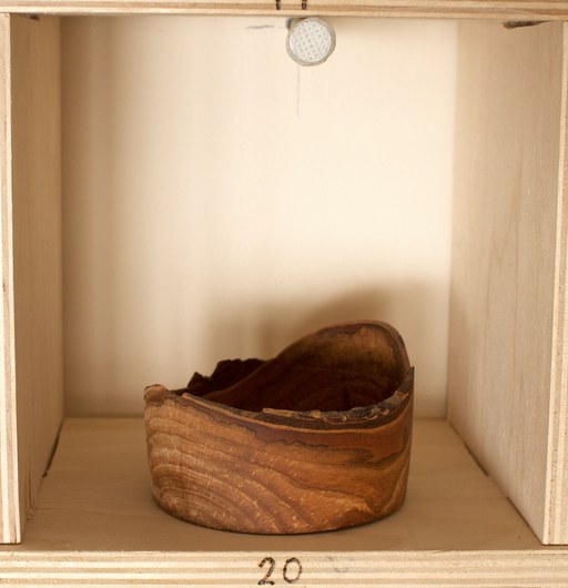 81 hand-turned wooden bowls on a home-made 9x9 compartment shelf