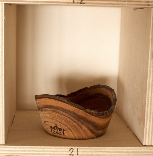 81 hand-turned wooden bowls on a home-made 9x9 compartment shelf