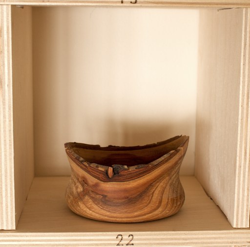 81 hand-turned wooden bowls on a home-made 9x9 compartment shelf