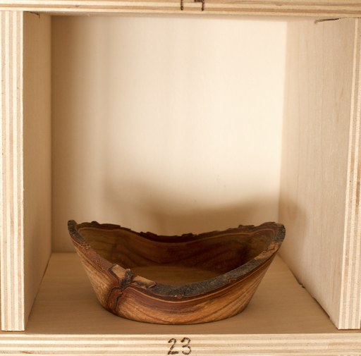 81 hand-turned wooden bowls on a home-made 9x9 compartment shelf