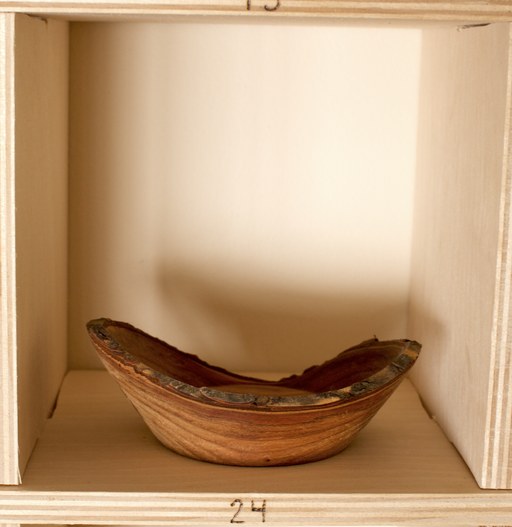 81 hand-turned wooden bowls on a home-made 9x9 compartment shelf