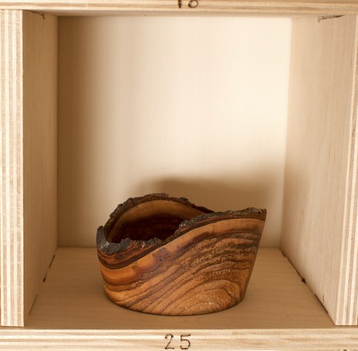 81 hand-turned wooden bowls on a home-made 9x9 compartment shelf