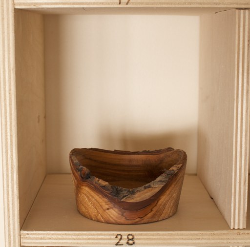 81 hand-turned wooden bowls on a home-made 9x9 compartment shelf