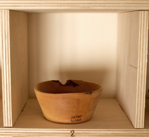 81 hand-turned wooden bowls on a home-made 9x9 compartment shelf