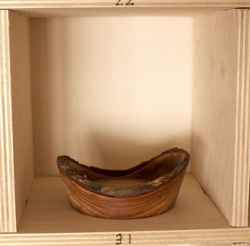 81 hand-turned wooden bowls on a home-made 9x9 compartment shelf