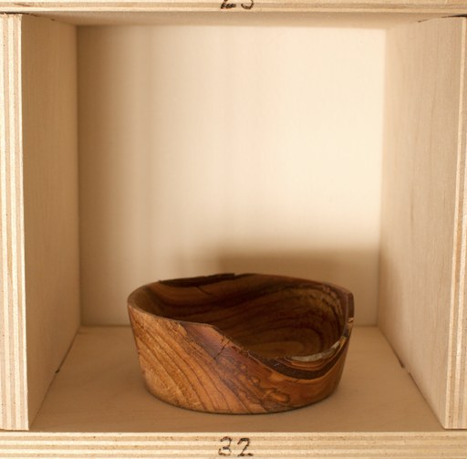 81 hand-turned wooden bowls on a home-made 9x9 compartment shelf