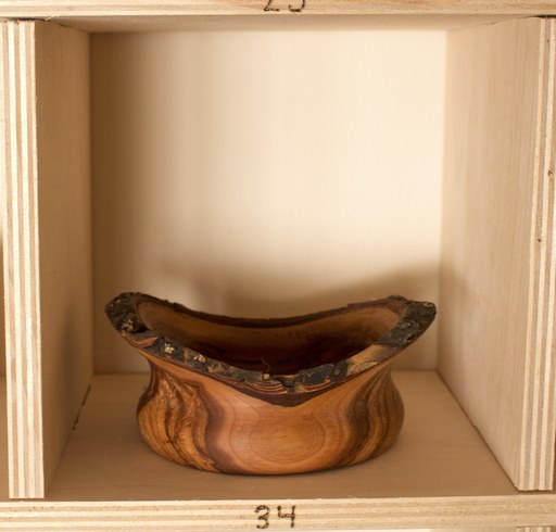 81 hand-turned wooden bowls on a home-made 9x9 compartment shelf