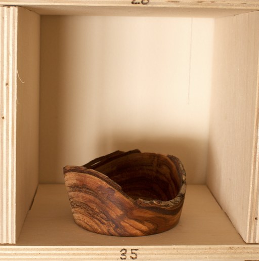 81 hand-turned wooden bowls on a home-made 9x9 compartment shelf