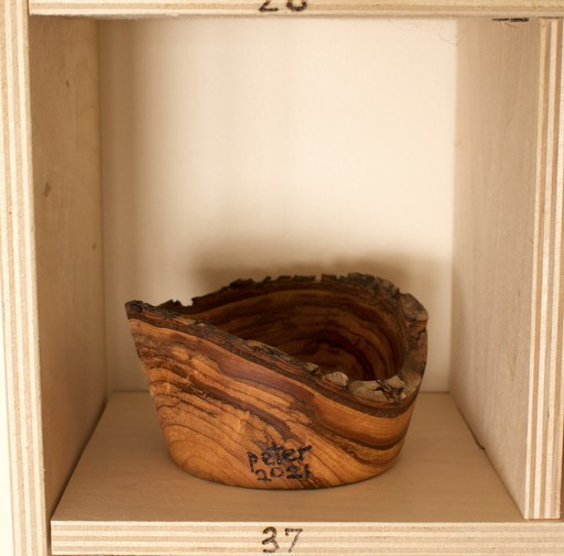 81 hand-turned wooden bowls on a home-made 9x9 compartment shelf