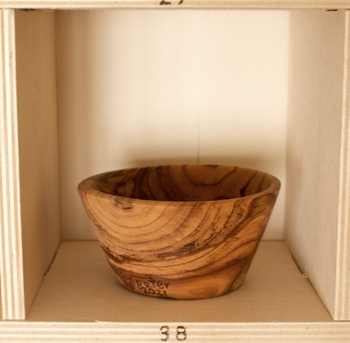 81 hand-turned wooden bowls on a home-made 9x9 compartment shelf