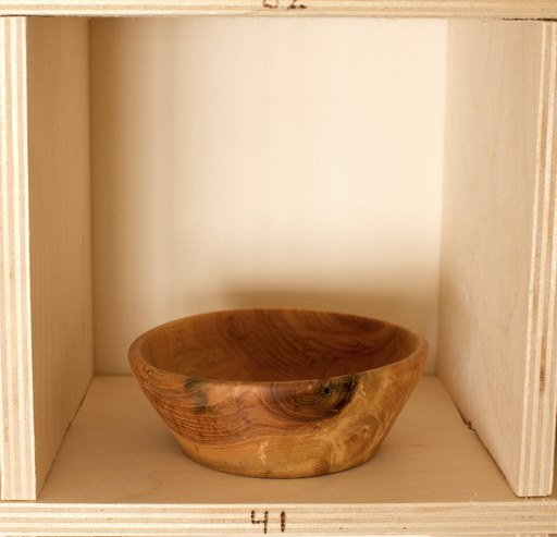 81 hand-turned wooden bowls on a home-made 9x9 compartment shelf