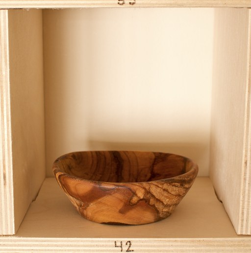 81 hand-turned wooden bowls on a home-made 9x9 compartment shelf