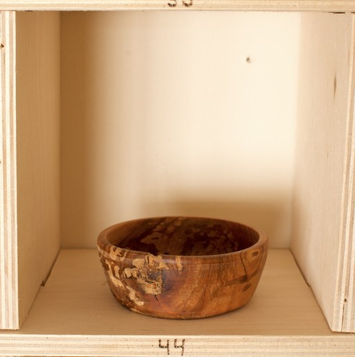 81 hand-turned wooden bowls on a home-made 9x9 compartment shelf