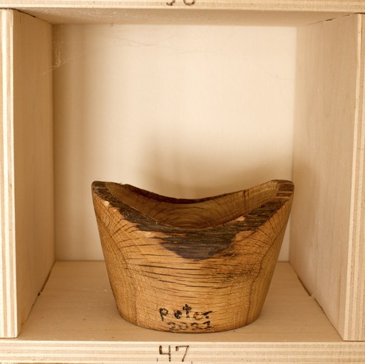 81 hand-turned wooden bowls on a home-made 9x9 compartment shelf