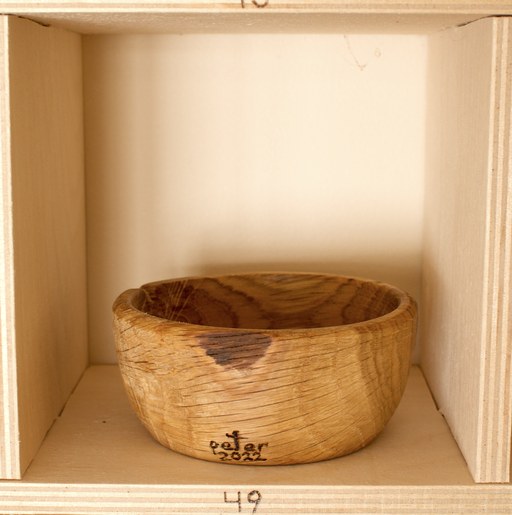 81 hand-turned wooden bowls on a home-made 9x9 compartment shelf