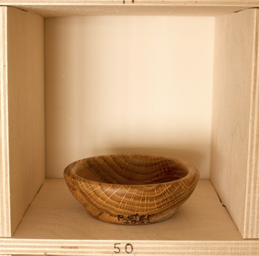 81 hand-turned wooden bowls on a home-made 9x9 compartment shelf