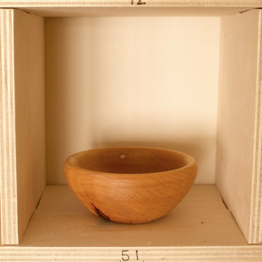 81 hand-turned wooden bowls on a home-made 9x9 compartment shelf