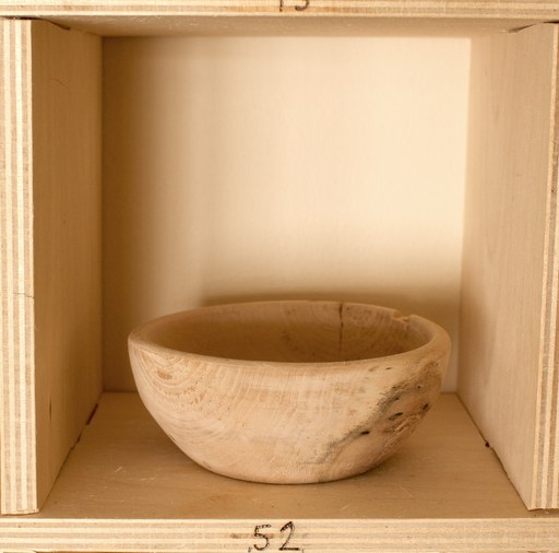 81 hand-turned wooden bowls on a home-made 9x9 compartment shelf