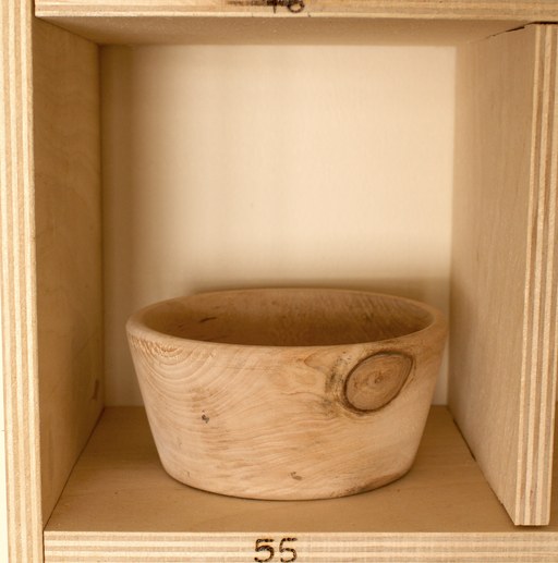 81 hand-turned wooden bowls on a home-made 9x9 compartment shelf