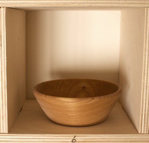 81 hand-turned wooden bowls on a home-made 9x9 compartment shelf