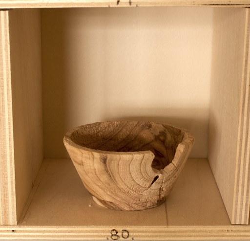 81 hand-turned wooden bowls on a home-made 9x9 compartment shelf