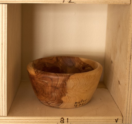 81 hand-turned wooden bowls on a home-made 9x9 compartment shelf