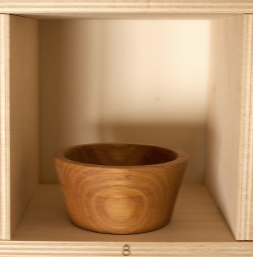 81 hand-turned wooden bowls on a home-made 9x9 compartment shelf