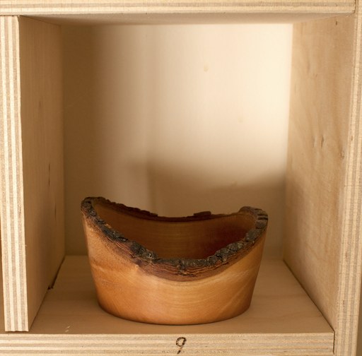 81 hand-turned wooden bowls on a home-made 9x9 compartment shelf