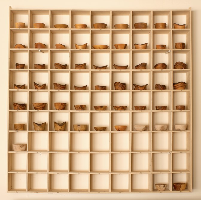 81 hand-turned wooden bowls on a home-made 9x9 compartment shelf